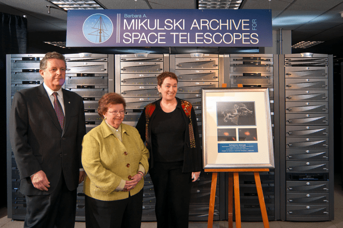 This is a view of the many computers that are part of the Barbara A. Mikulski Archive for Space Telescopes (MAST), located at the Space Telescope Science Institute (STScI) in Baltimore, Md. The archive is named in honor of the United States Senator from Maryland for her career-long achievements and becoming the longest-serving woman in U.S. Congressional history. MAST is NASA’s repository for all of its optical and ultraviolet-light observations, some of which date to the early 1970s. The archive holds data from 16 NASA telescopes, including current missions such as the Hubble Space Telescope and Kepler. Senator Mikulski is in the center, STScI Director Matt Mountain at her right, and STScI Deputy Director Kathryn Flanagan at her left. The plaque to image right is a photo of Supernova Milkuski, an exploding star that the Hubble Space Telescope spotted on Jan. 25, 2012. It was named in honor of the Senator by Nobel Laureate Adam Riess and the supernova search team with which he is currently working. The supernova, which lies 7.4 billion light-years away, is the titanic detonation of a star more than eight times as massive as our Sun.